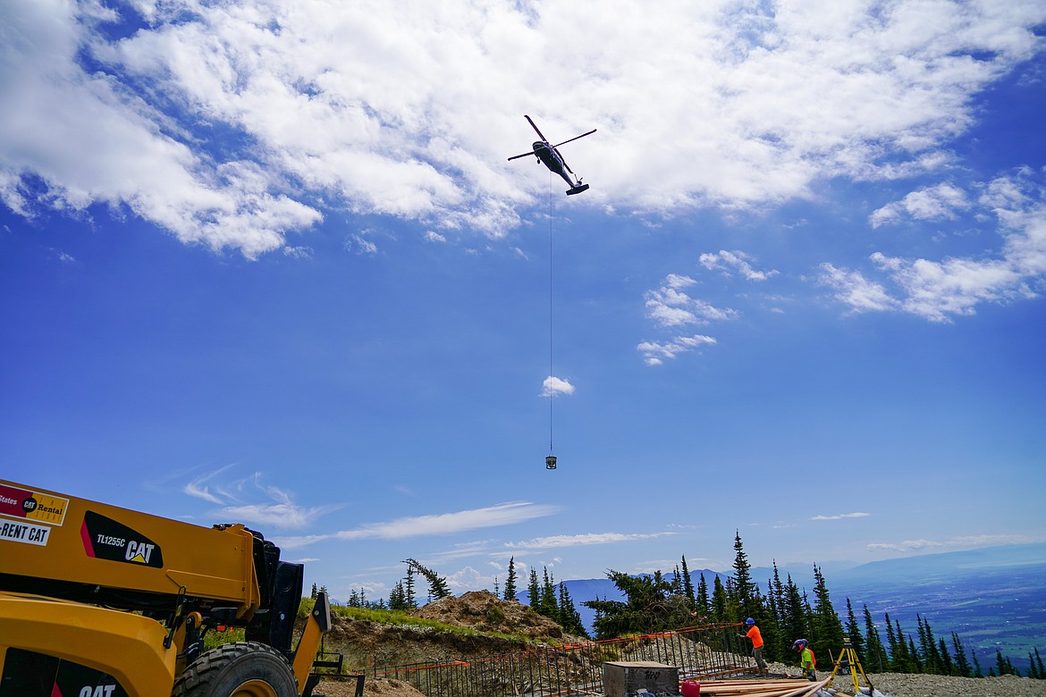 A Black Hawk helicopter delivers concrete as part of the construction of the new Chair 4 at Whitefish Mountain Resort. (Photo courtesy Whitefish Mountain Resort)