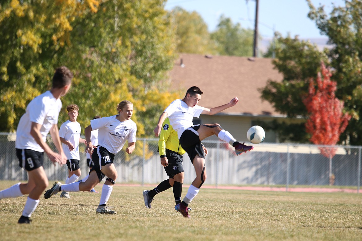 Photo by ZACH CHAN
Lake City High soccer players Beckham Dodge, Ryder Torgersen and Noah Waddell close in on the net during Thursday's state 5A opener against Coeur d'Alene at Hillcrest High in Ammon.