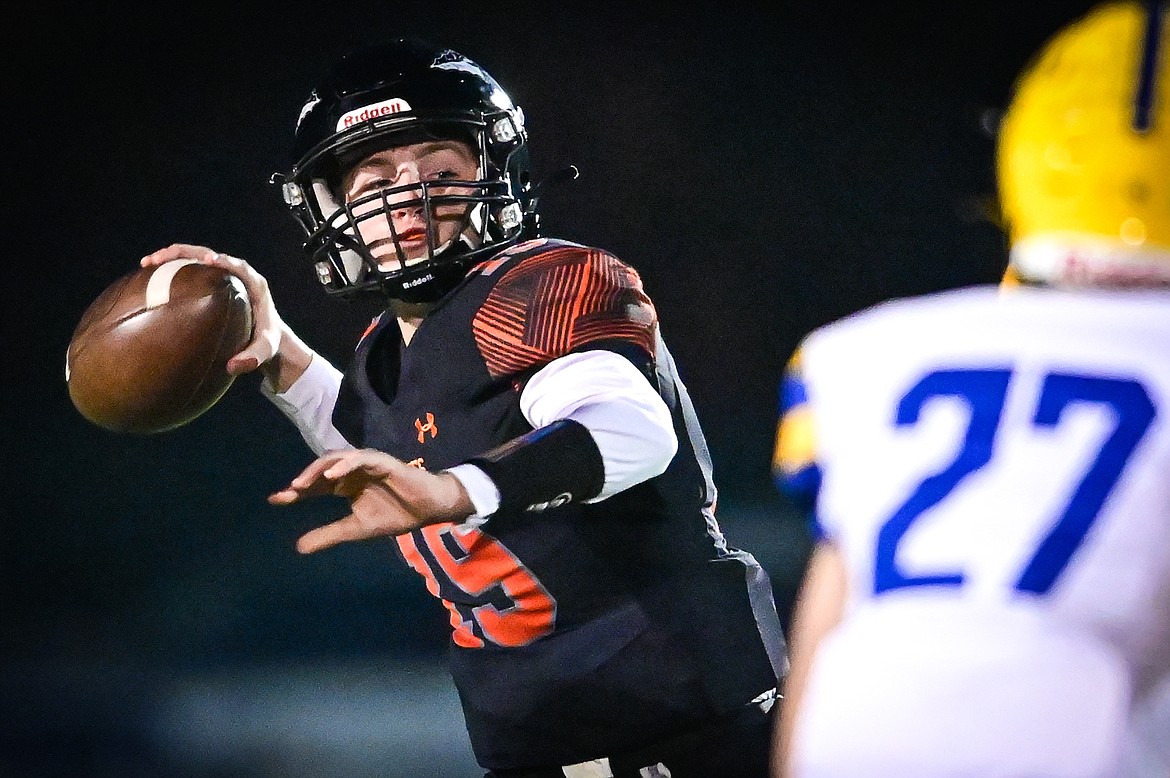 Flathead quarterback Nate Skonord (19) completes a deep pass to wide receiver Brody Thornsberry in the first quarter against Missoula Big Sky at Legends Stadium on Thursday, Oct. 20. (Casey Kreider/Daily Inter Lake)