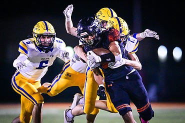 Flathead running back Joe Jones (9) picks up yardage on a run in the second quarter against Missoula Big Sky at Legends Stadium on Thursday, Oct. 20. (Casey Kreider/Daily Inter Lake)
