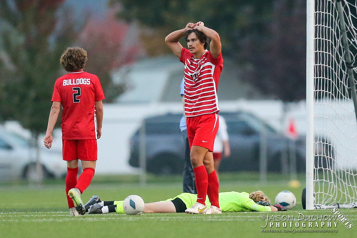 Stirling Roget (11) Jett Longanecker (2) and Kai Longanecker shows their dejection after the Bulldogs were defeated in extra time in the opening round of the state 4A boys soccer tournament.