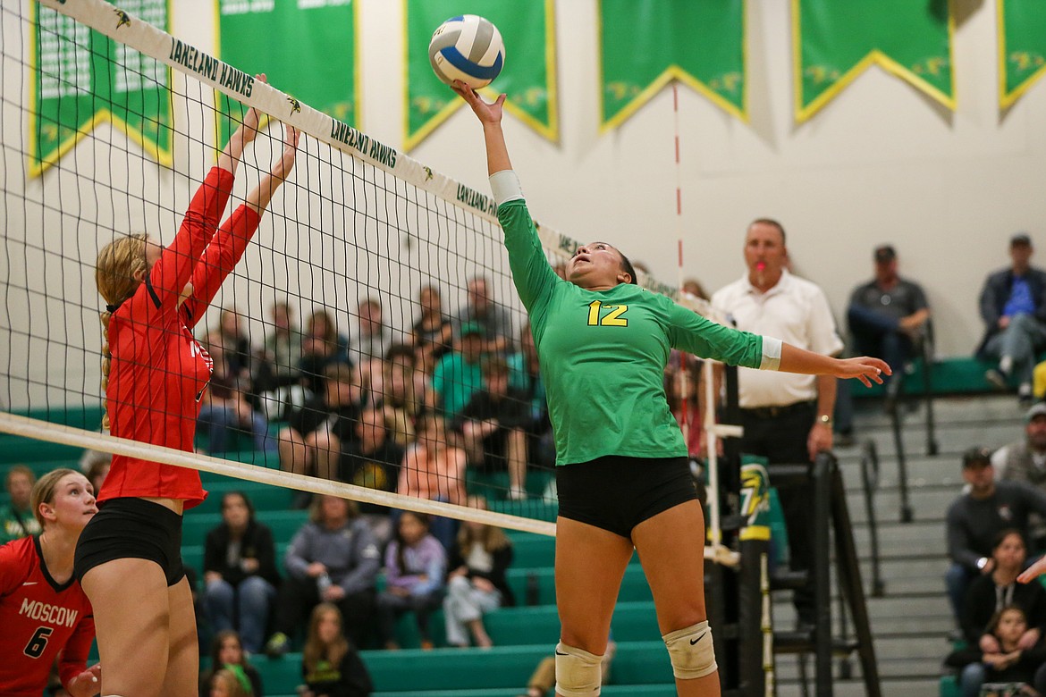 JASON DUCHOW PHOTOGRAPHY
Olivia Zazuetta (12) of Lakeland reaches for a ball at the net during the 4A Region 1 volleyball championship match against Moscow on Thursday night at Hawk Court in Rathdrum.