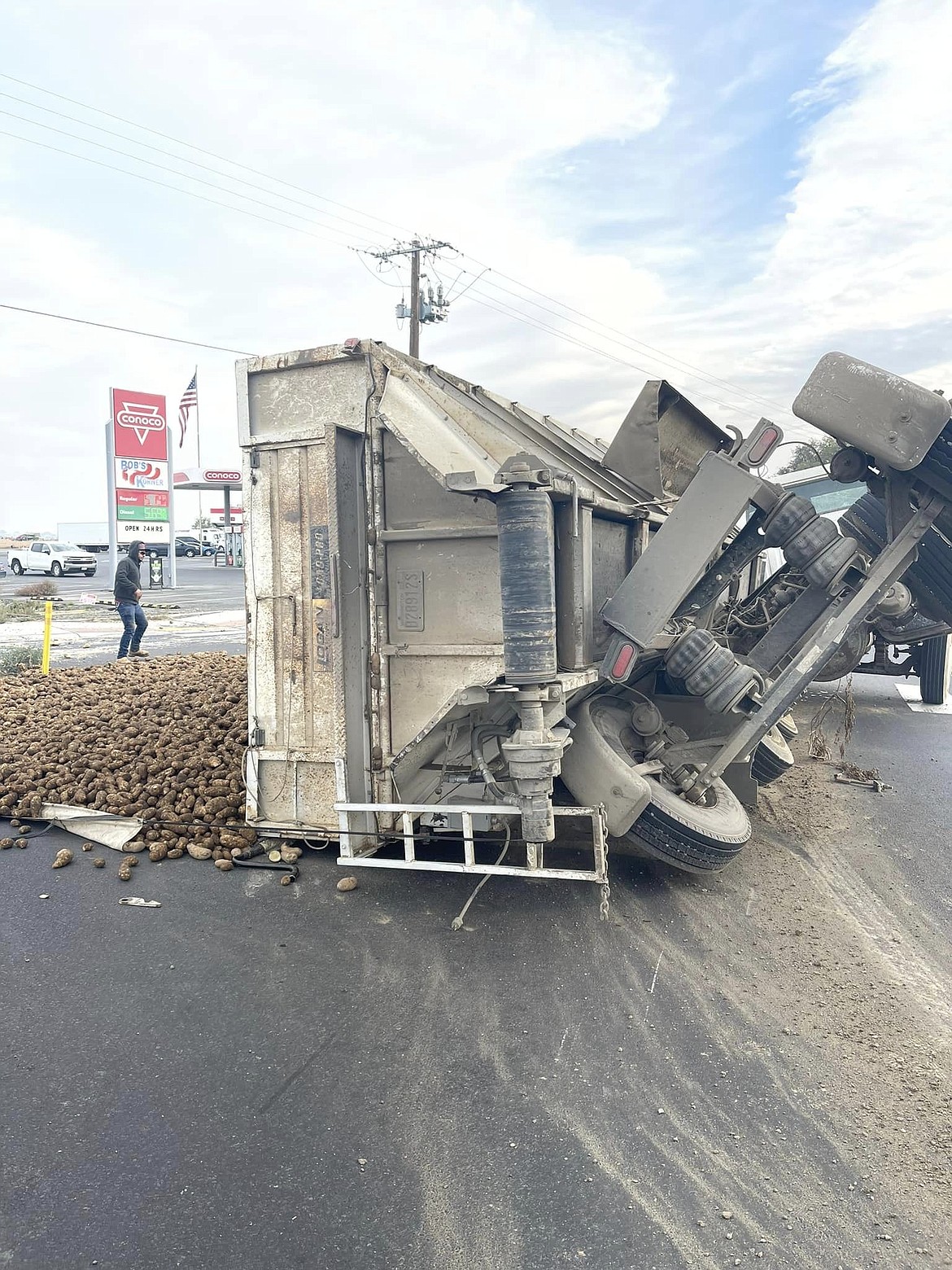 The intersection of S.R. 24 and Bench Road south of Othello was blocked for roughly two hours on Thursday after a potato truck partially overturned, spilling potatoes across the road.