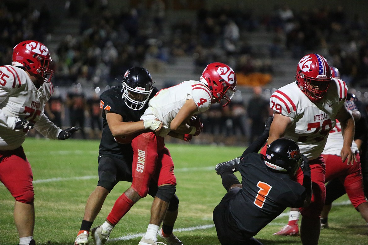 Othello running back Sonny Asu fights for extra yardage late in the fourth quarter against Ephrata.