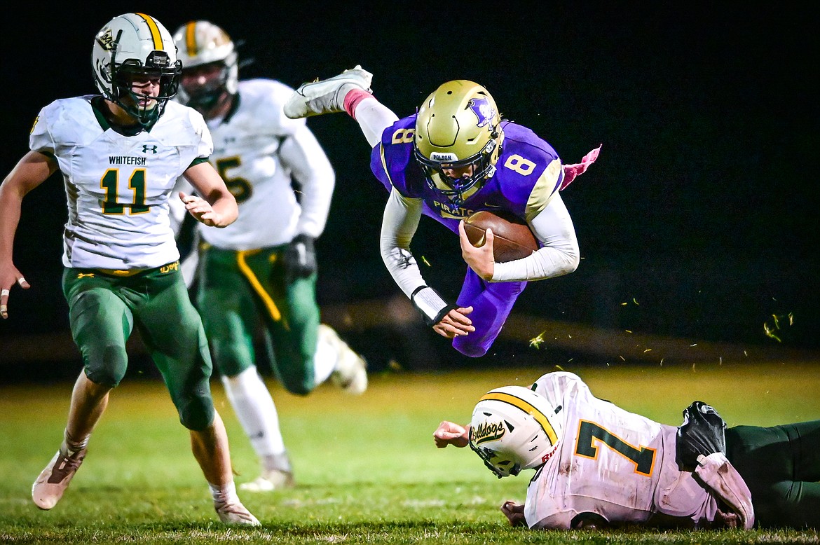 Polson quarterback Jarrett Wilson (8) goes airborne as he is tackled by Whitefish defensive back Fynn Ridgeway (7) in the second quarter at Polson High School on Friday, Oct. 21. (Casey Kreider/Daily Inter Lake)