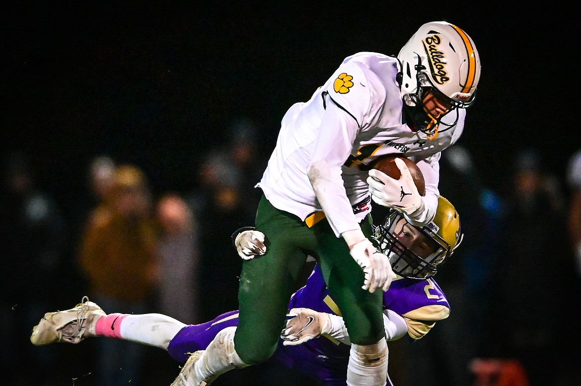 Whitefish wide receiver Mason Kelch (10) is brought down by Polson's Colter Wilson (2) on a reception in the second quarter at Polson High School on Friday, Oct. 21. (Casey Kreider/Daily Inter Lake)