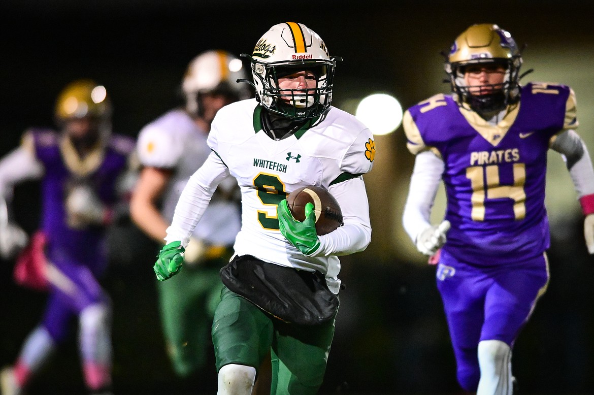 Whitefish kick returner Clayton Godsey (9) breaks a return into Polson territory in the first quarter at Polson High School on Friday, Oct. 21. (Casey Kreider/Daily Inter Lake)