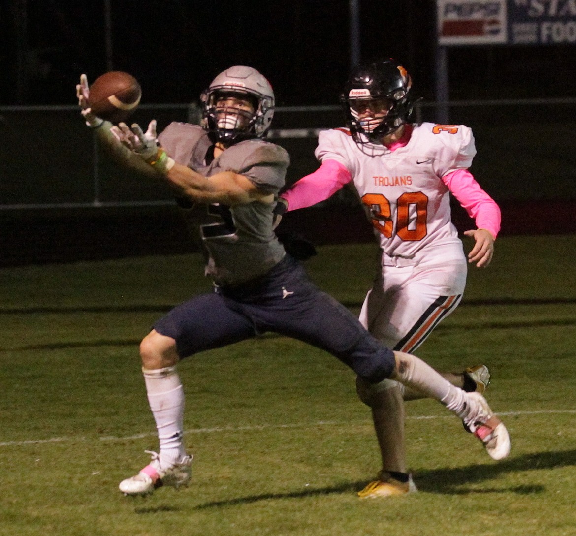 MARK NELKE/Press
Brayden Ross of Lake City catches a touchdown pass in the fourth quarter, as Keelan Arnold of Post Falls defends.