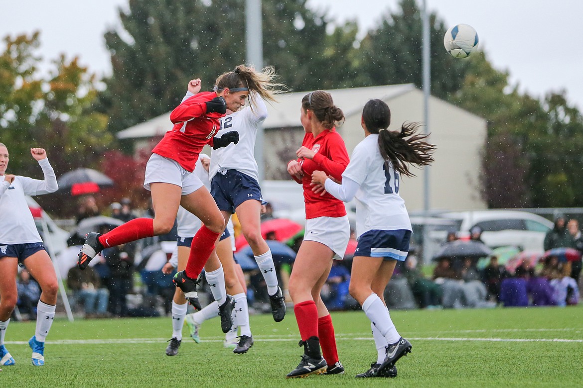 Aliya Strock heads a ball away from net on defense during the Bulldogs battle with Twin Falls Friday during the 4A State Soccer Tournament.