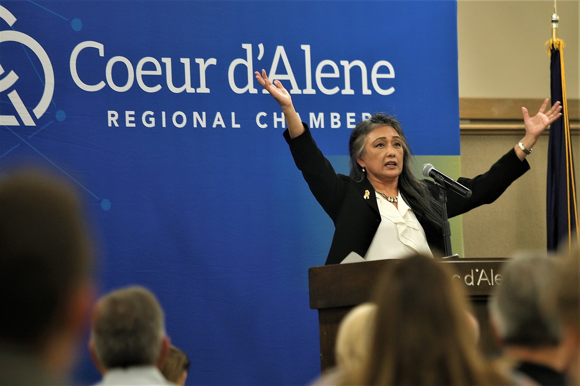 ​Gynii Gilliam gestures during her presentation at Friday's "Navigating the Growth of Kootenai County" at the Best Western Plus Coeur d'Alene Inn.