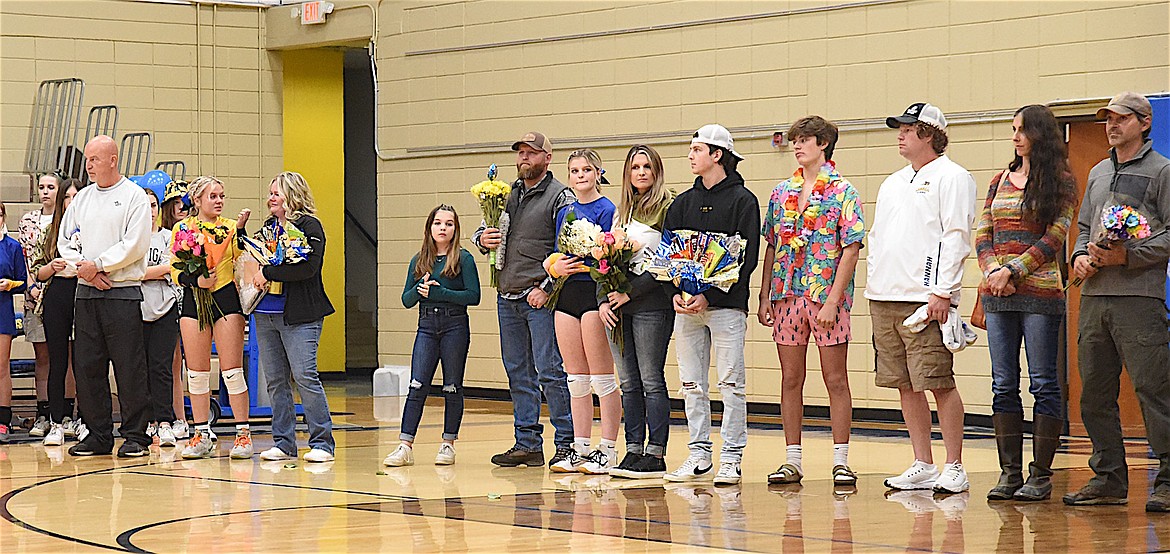 Libby High School volleyball players Kinzee Boehmler and Macey Halvorson, their families and favorite teachers were recognized during Senior Night festivities Saturday at the volleyball match. (Scott Shindledecker/The Western News)