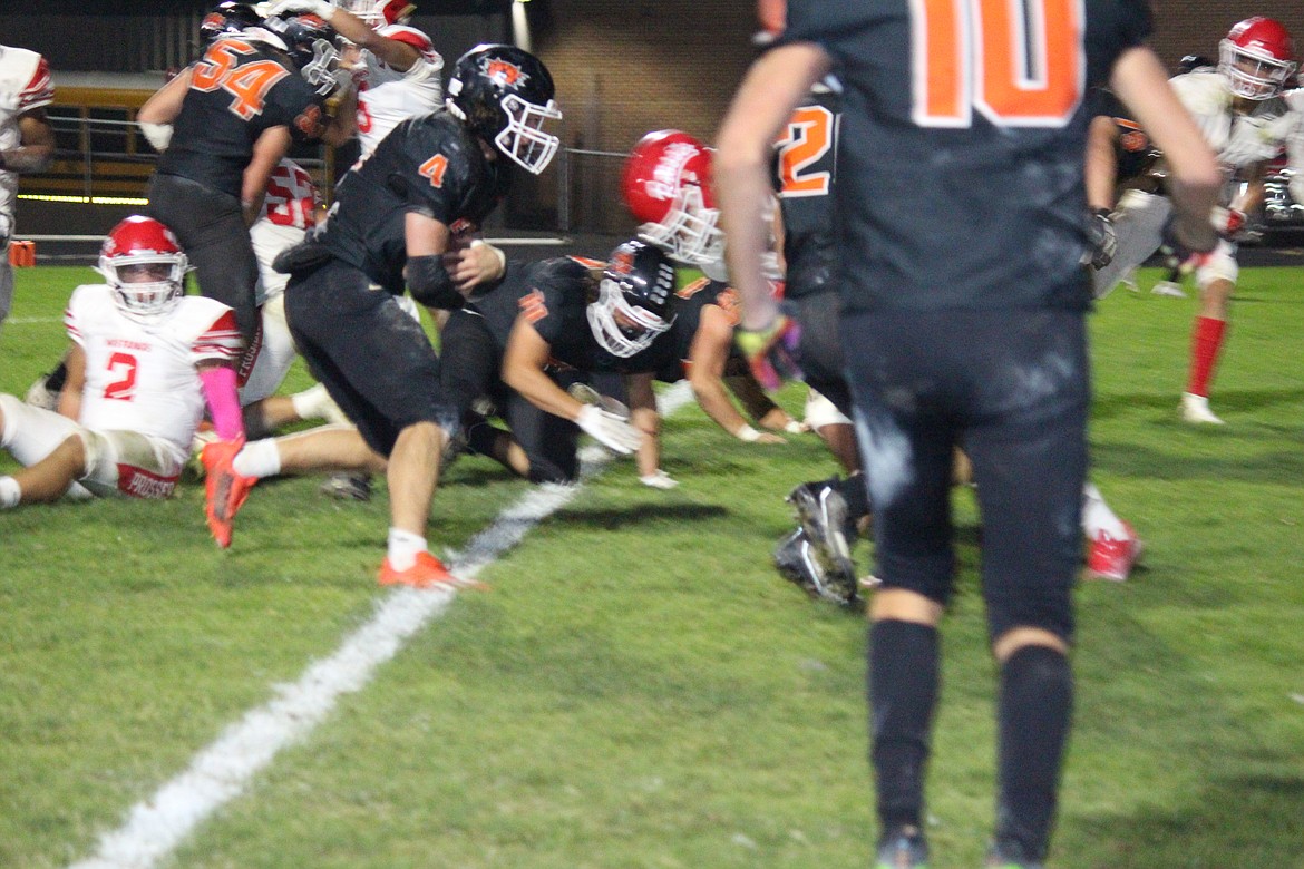 Ephrata quarterback Travis Hendrick (4) crosses the goal line in the Tigers’ 20-17 win over the Prosser Mustangs.