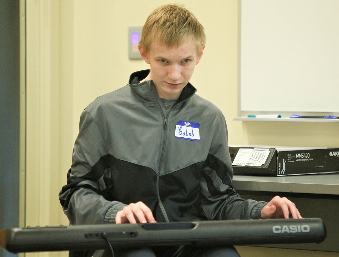 Caleb Hyzman plays the keyboards "Celebraille" at North Idaho College on Saturday.