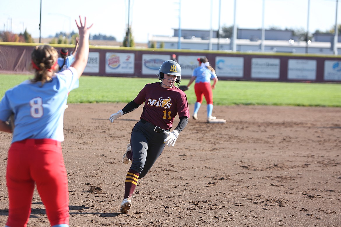 Moses Lake senior Piper Bradshaw rounds third base and scores against West Valley in the Columbia Basin Big 9 district championship.
