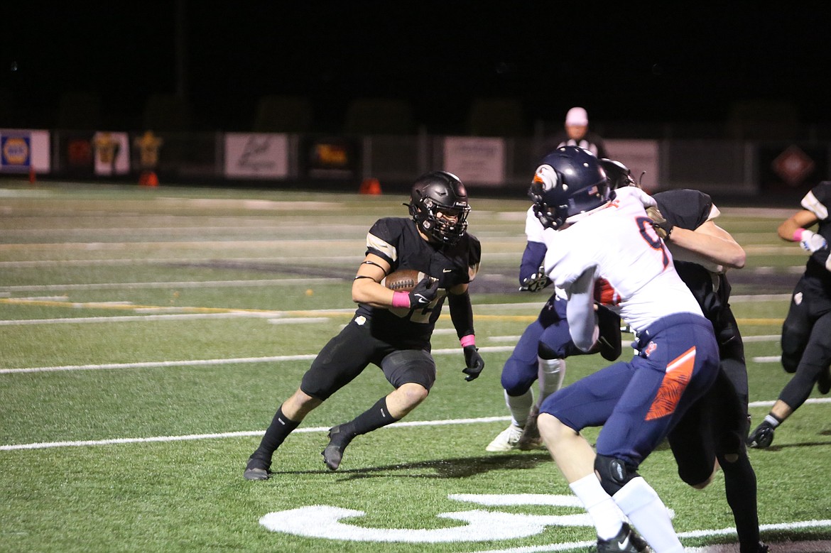 Senior running back Kaleb Hernandez cuts upfield to run through a hole made by the Royal offensive line.