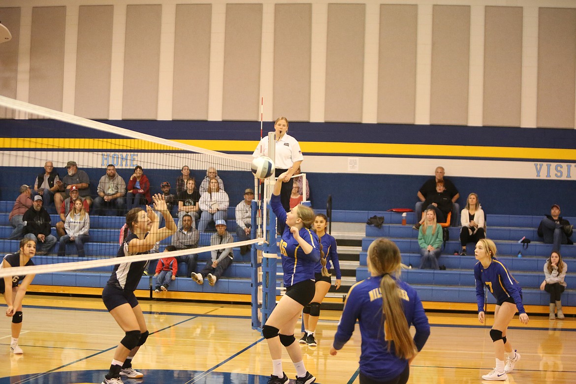 Wilson Creek sophomore Maddie Finkbeiner rises to return a pass over the net.