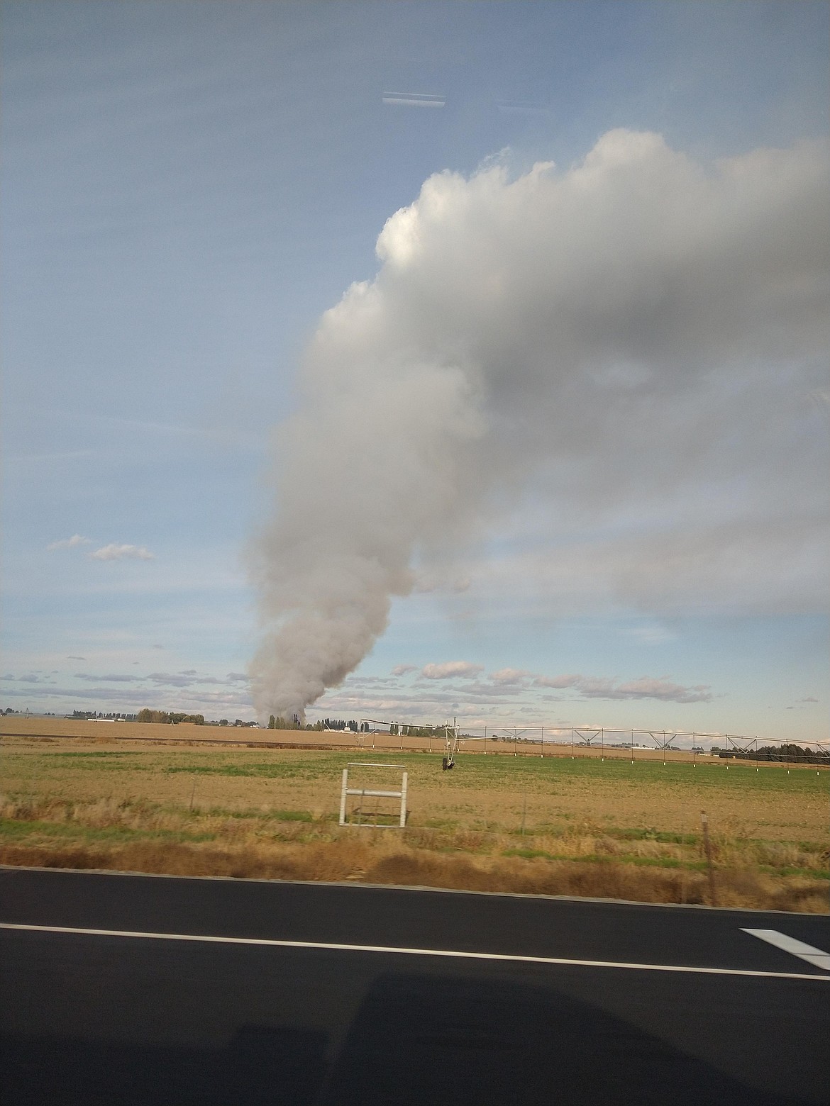Columbia Basin Herald reader Jay Welch provided this photo of smoke coming off of the Wilbur-Ellis fertilizer plant Sunday. Residents nearby were advised to remain inside and close of sources of air from outside the home until the fire was under control.
