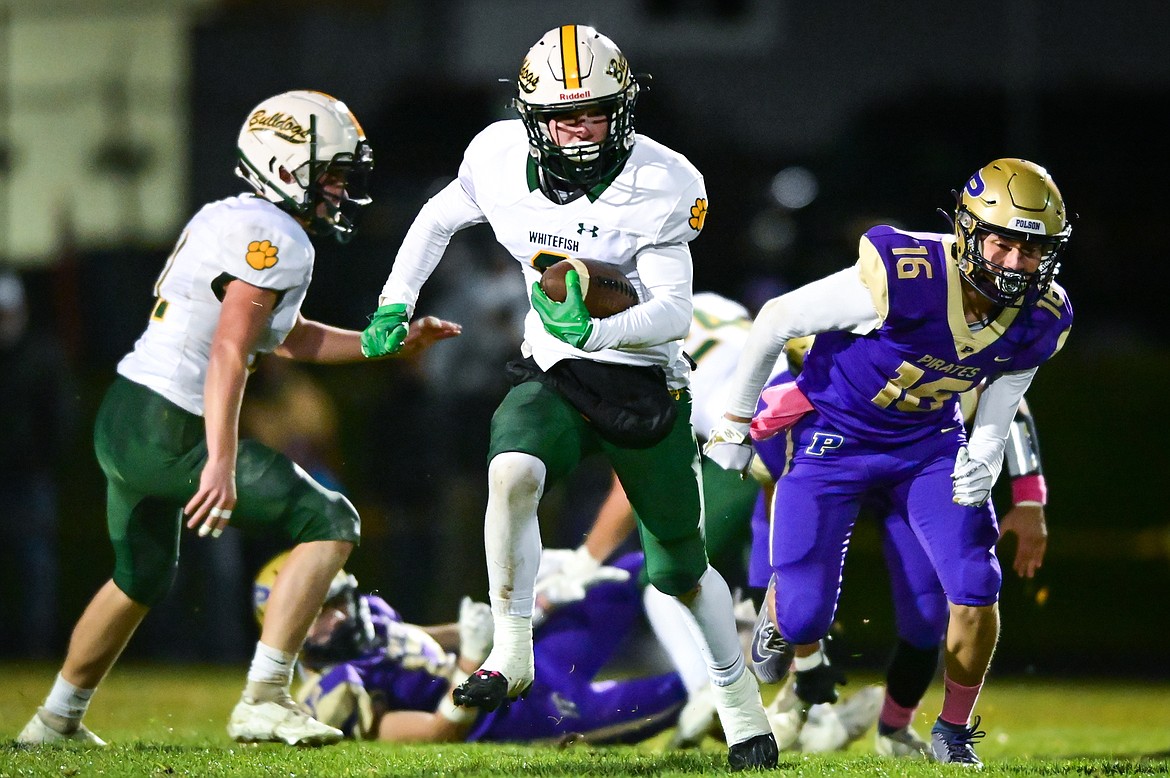 Whitefish kick returner Clayton Godsey (9) breaks a return into Polson territory in the first quarter at Polson High School on Friday, Oct. 21. (Casey Kreider/Daily Inter Lake)