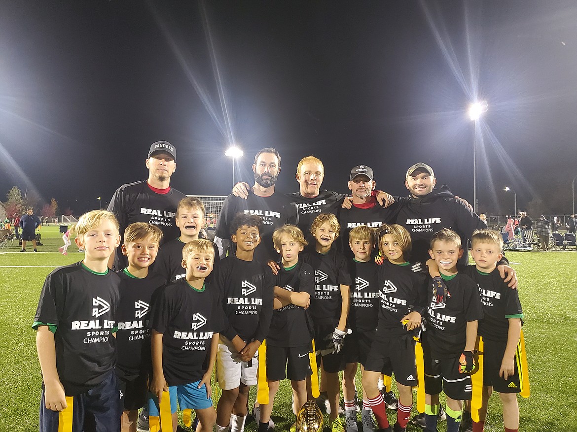 Courtesy photo
Lights Out won the 3rd/4th grade flag football championship in Real Life Sports. In the front row from left are Kellen Larson, Jimmy Greene, Sander Bundy, Harrison Berdan, Aure Brennan, Brody Brennan, Mac Roberts, Finn Hebener, Camden Nelson, Brody Cantrell and Jacob Priddy; and back rowfrom left, coaches Levi Brennan, Pete Roberts, Jon Larson, Nate Brennan and Jon Cantrell.