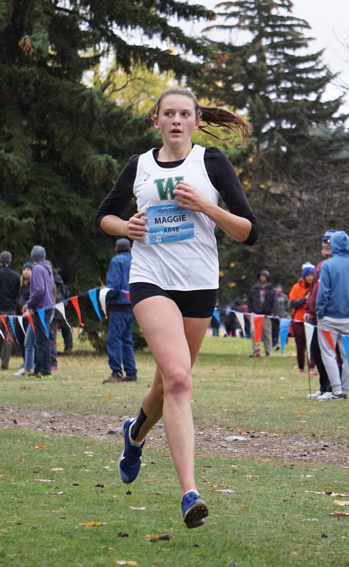 Senior and team captain, Maggie Pulsifer, ran a season best 22:33 in her final high school cross country race. (Photo courtesy Matt Weller)