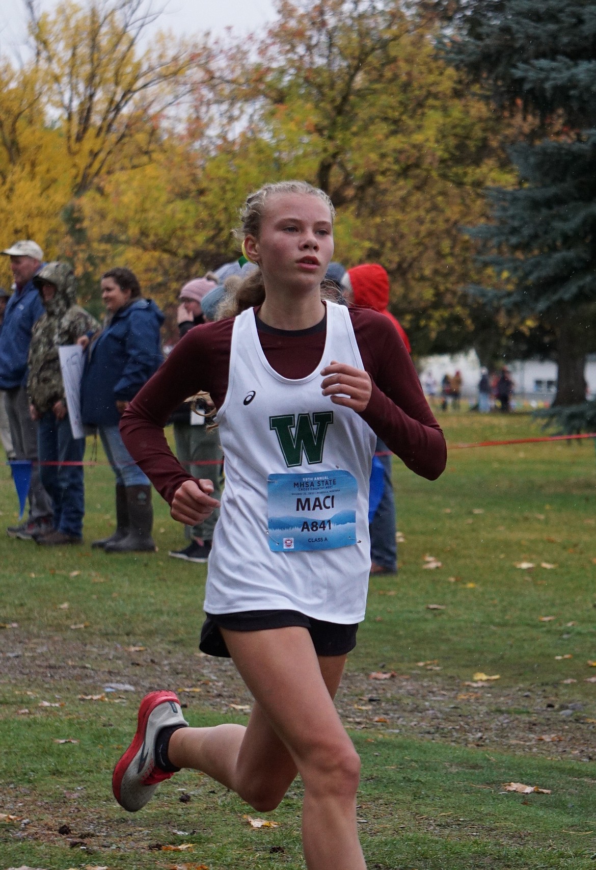Freshman Maci Brennan competes in her first State Championship lowering her personal best time by over a minute (22:45). (Photo courtesy Matt Weller)