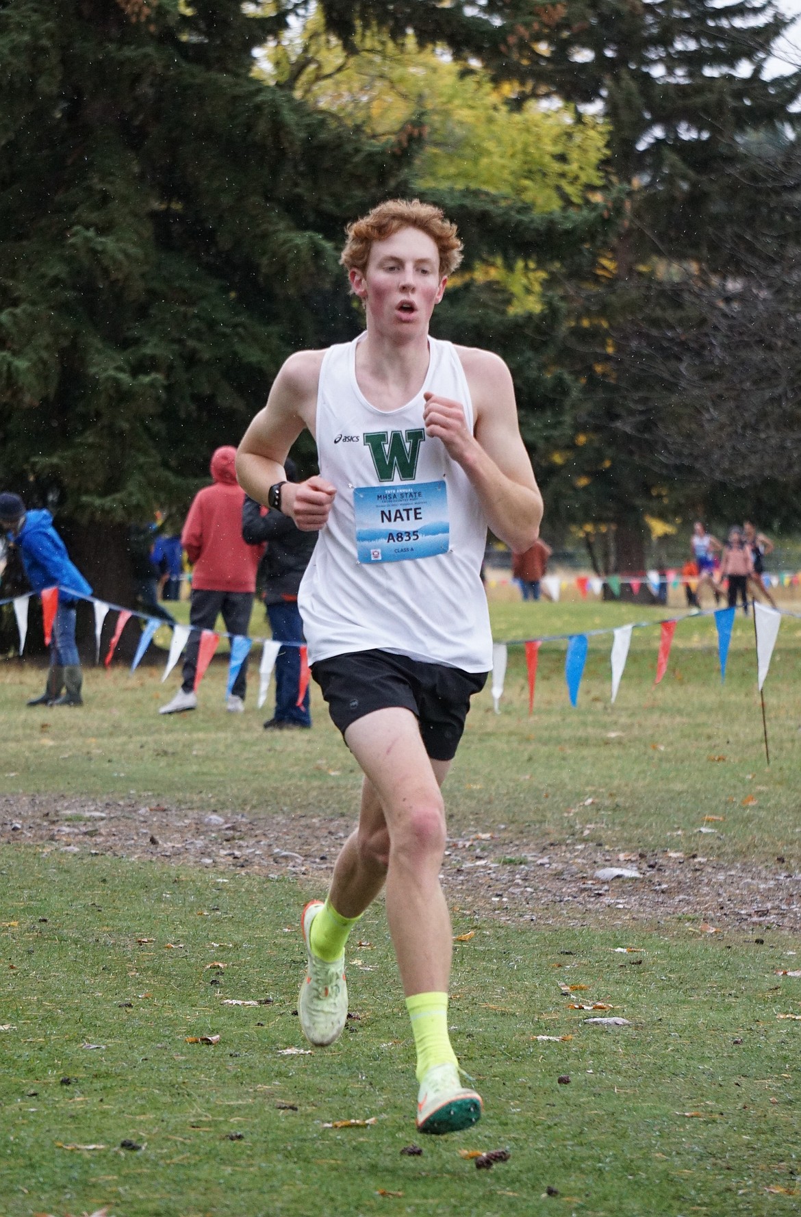 Senior Nate Ingelfinger charges towards the finish at his final State Championship race. (Photo courtesy Matt Weller)