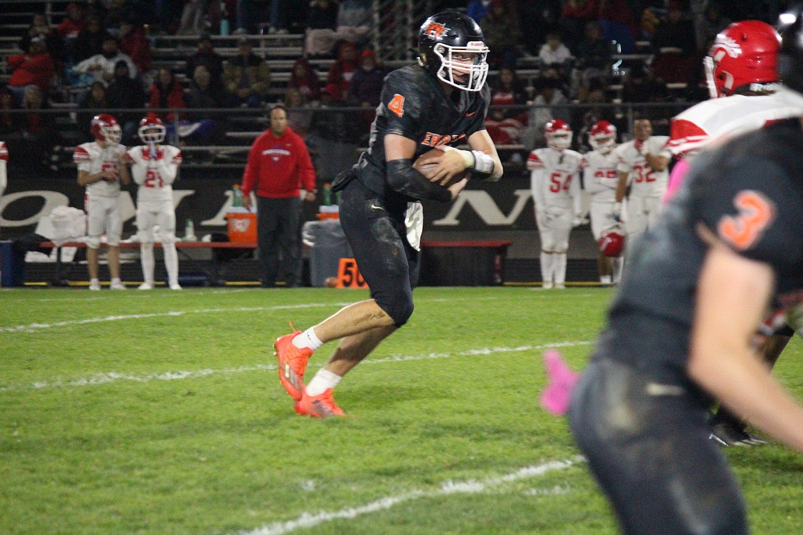 Ephrata quarterback Travis Hendrick (4) heads upfield during the Tigers' 20-17 win over Prosser Friday.