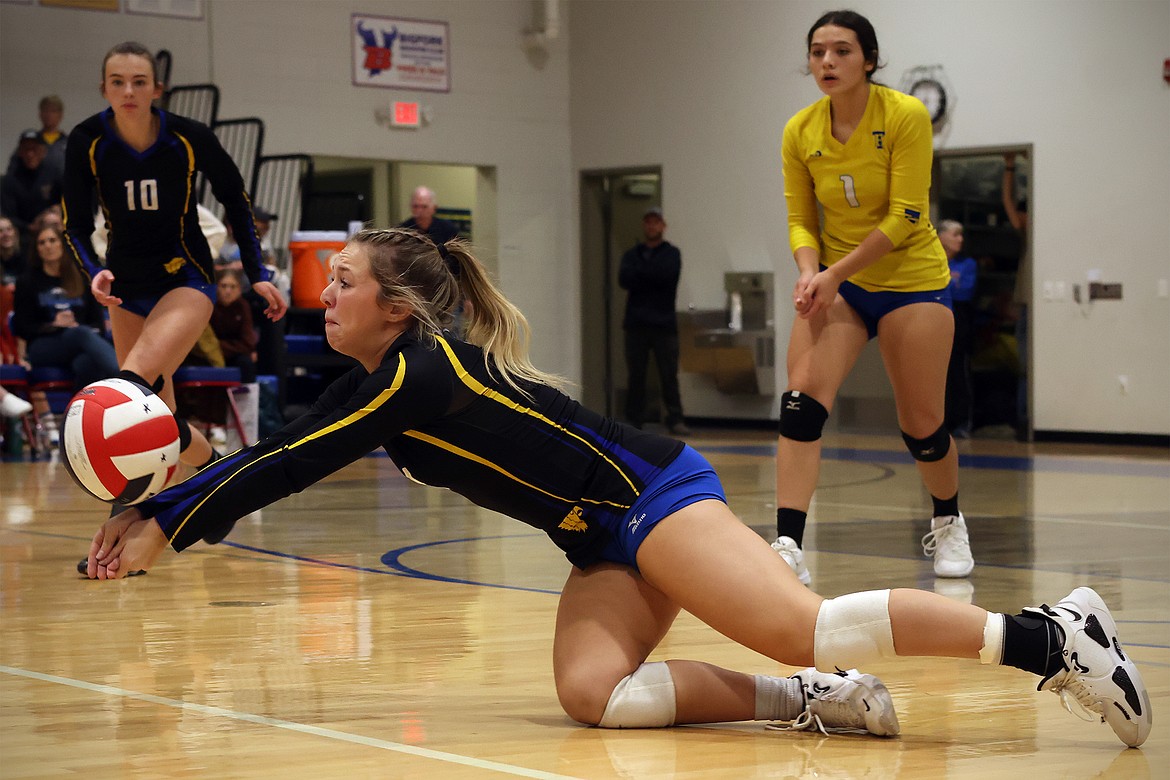 Alvia McCormick makes a diving play on the ball during action in Bigfork Saturday. (Jeremy Weber/Bigfork Eagle)