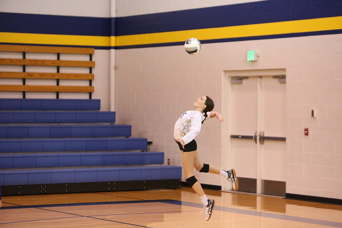 Wilson Creek junior Jessa Bise leaps up while serving the ball in the fourth set of the Devils’ 3-1 win over Riverside Christian.