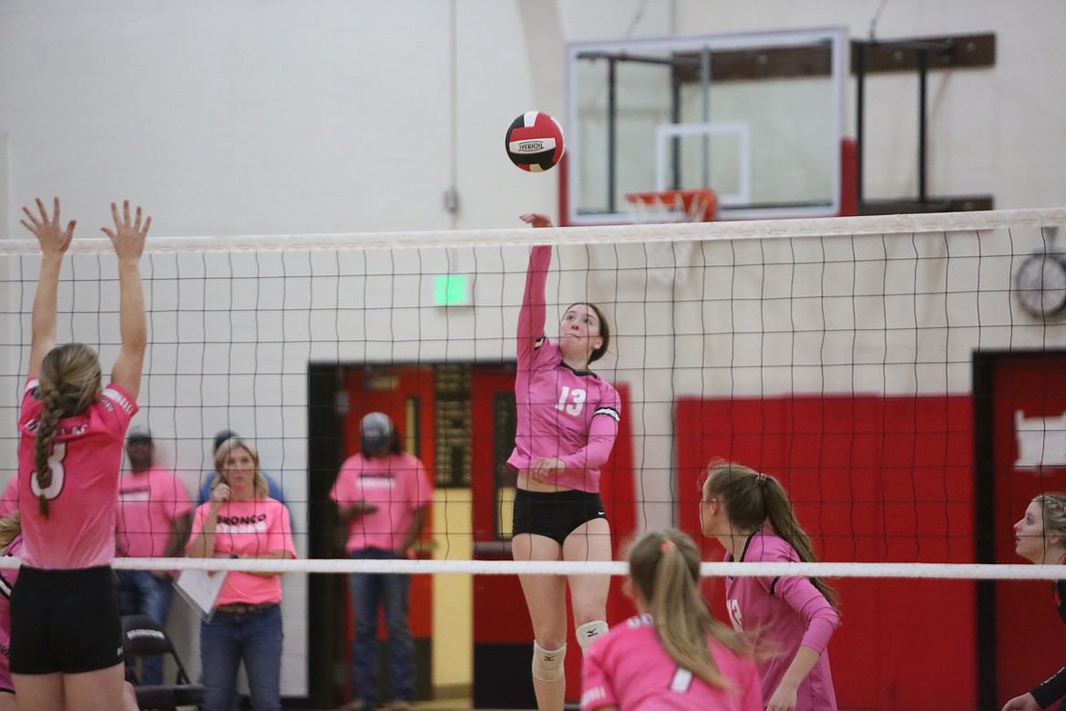 Broncos senior Taylor Galbreath taps the ball over the net for a kill in the second set against Davenport on Tuesday.