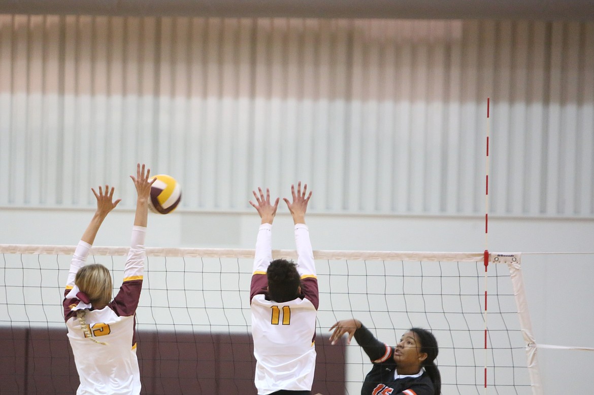 Moses Lake senior Kathryn Pugh (left) blocks the ball during senior night on Tuesday for the Mavericks.