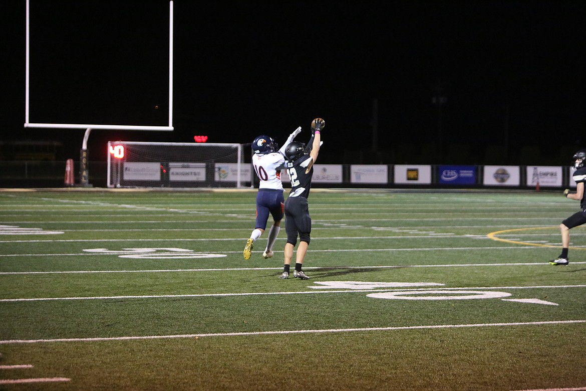 Royal sophomore Ethan Ellis outstretches a College Place receiver to intercept a pass in the first quarter.