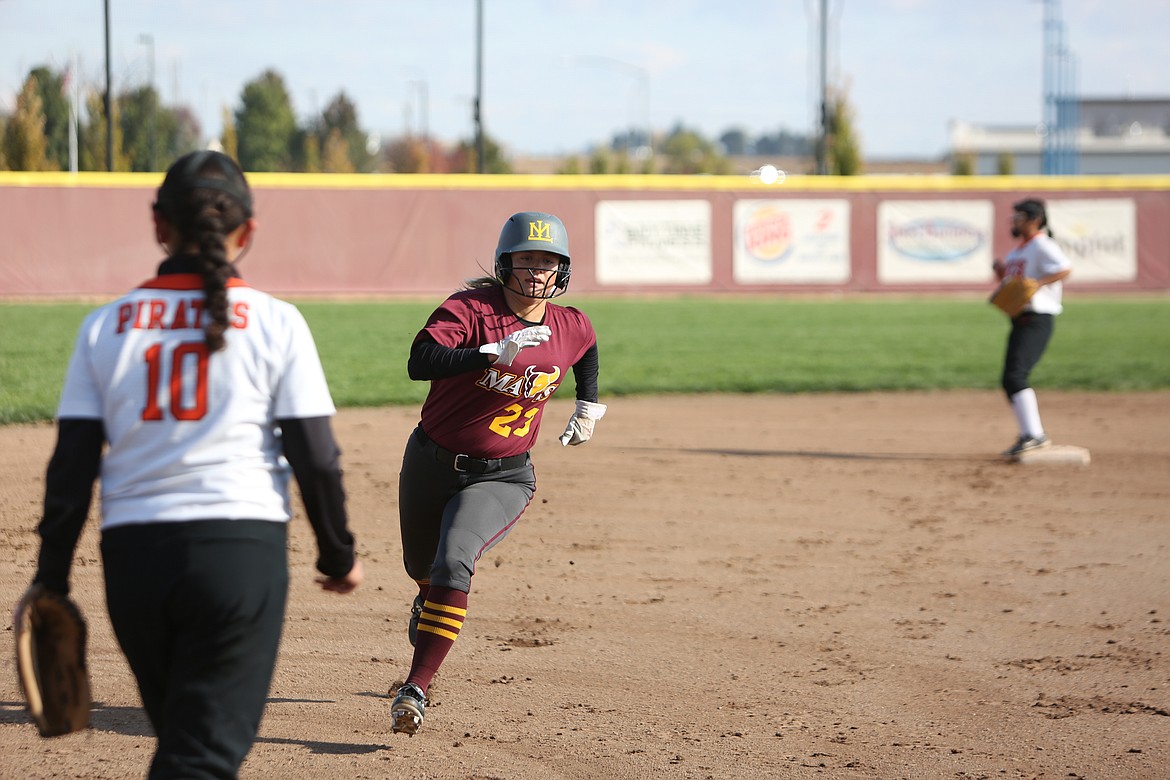 Moses Lake senior Katelyn Kriete rounds third base during the Mavericks’ 18-2 state-clinching win over Davis.