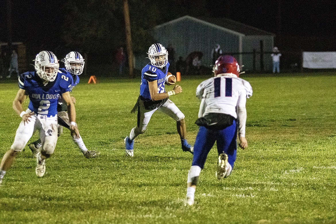 Mission Bulldog Kellen McClure searches for running room on a quarterback keeper. (Rob Zolman/Lake County Leader)