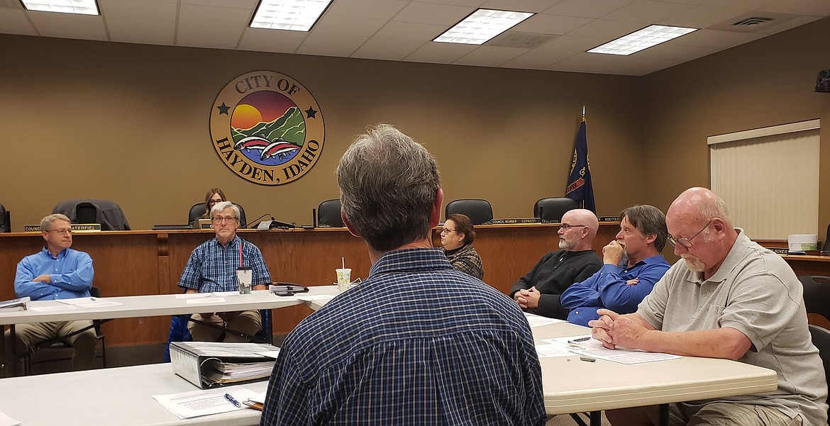 Clockwise from left: Hayden city administrator Brett Boyer, council members Matt Roetter, Sandy White, Ed DePriest, public works director Alan Soderling, council member Roger Saterfiel, and centered Hayden Mayor Scott Forssell, brainstorm in a workshop trying to find solutions to the Honeysuckle Beach crowding and access issues.