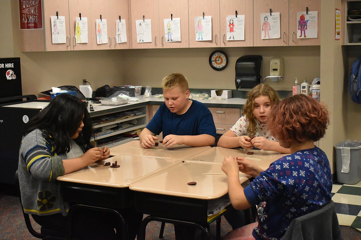 Students worked individually at their desks to create a small sculpture of their choosing with wax.