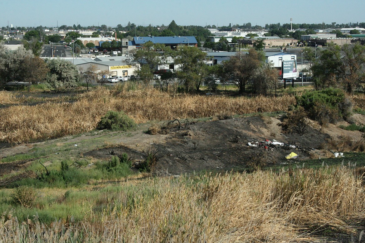 The remains of an encampment on Wheeler Road in Moses Lake, destroyed in a fire in late July.