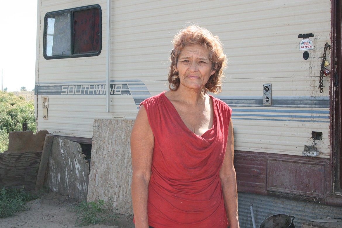 Lucy stands next to her motorhome in one of the encampments near Othello. She’s thinking about moving, someday, but she’s not ready yet, she said. Lucy’s full name has been left out of this report in order to preserve her family’s privacy as they work to help her. Lucy's current situation living in an old RV trailer without power is one form of homelessness many may not think about.