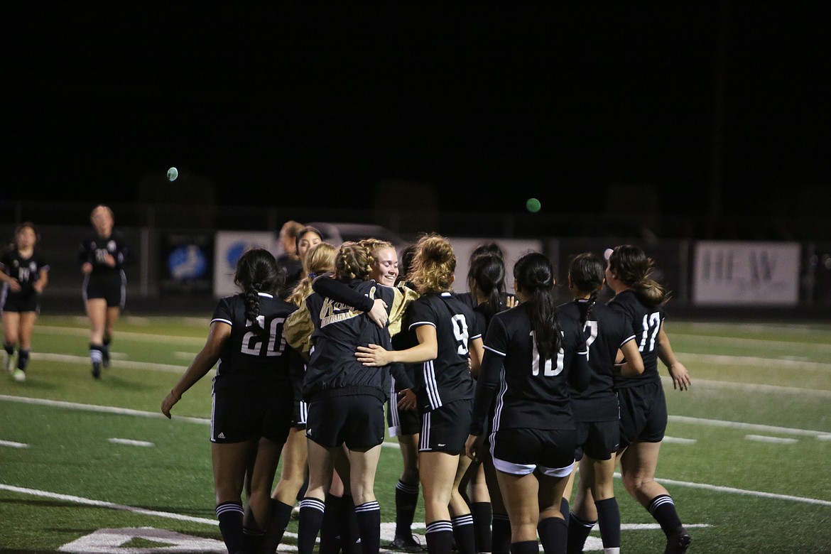 Royal players celebrate after the Knights’ 2-0 win over La Salle on senior night.