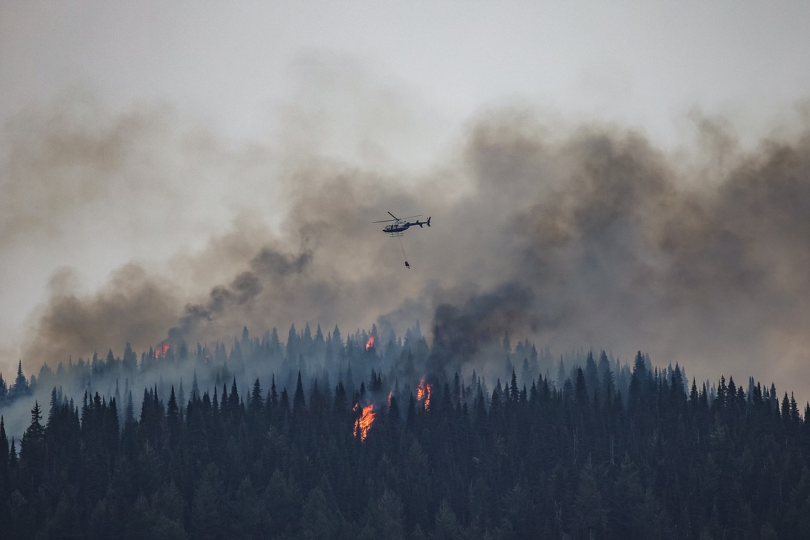 A helicopter comes back to refuel after igniting a prescribed burn on Big Mountain. (JP Edge photo)