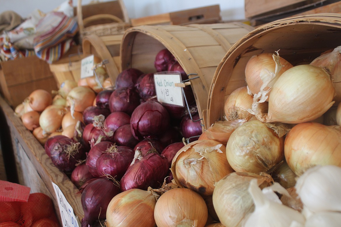 Onions fill a row of baskets at the Sunny Farms produce stand near Othello, Washington.