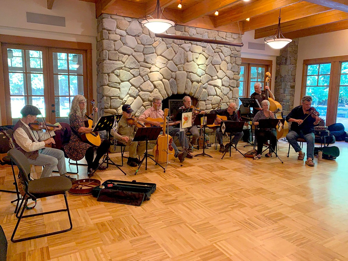 The local Idaho Old-Time Fiddlers Association performing group plays a POAC-sponsored event earlier this month as part of the Dist. 1A music outreach program. From left: Desiree Aguirre, Joanne Pos Cottrell, Les Tucker, Don Davis, Mark Weber, Dave Immel, Mike Boeck, Laurie Bethke, Dave Gunter.