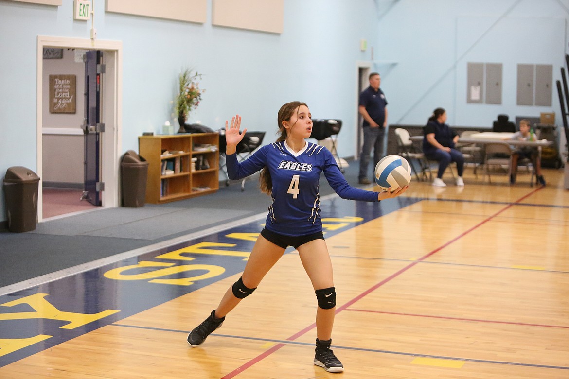 Soap Lake freshman Sage Hart serves the ball in the second set against Wilson Creek.