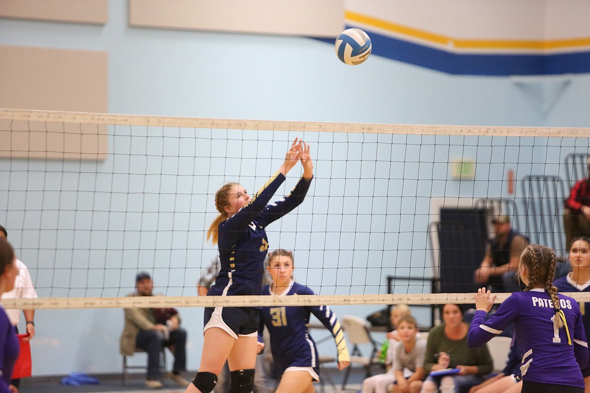 MLCA/CCS senior Kali Kast taps the ball over the net in the sweep over Pateros on Thursday.