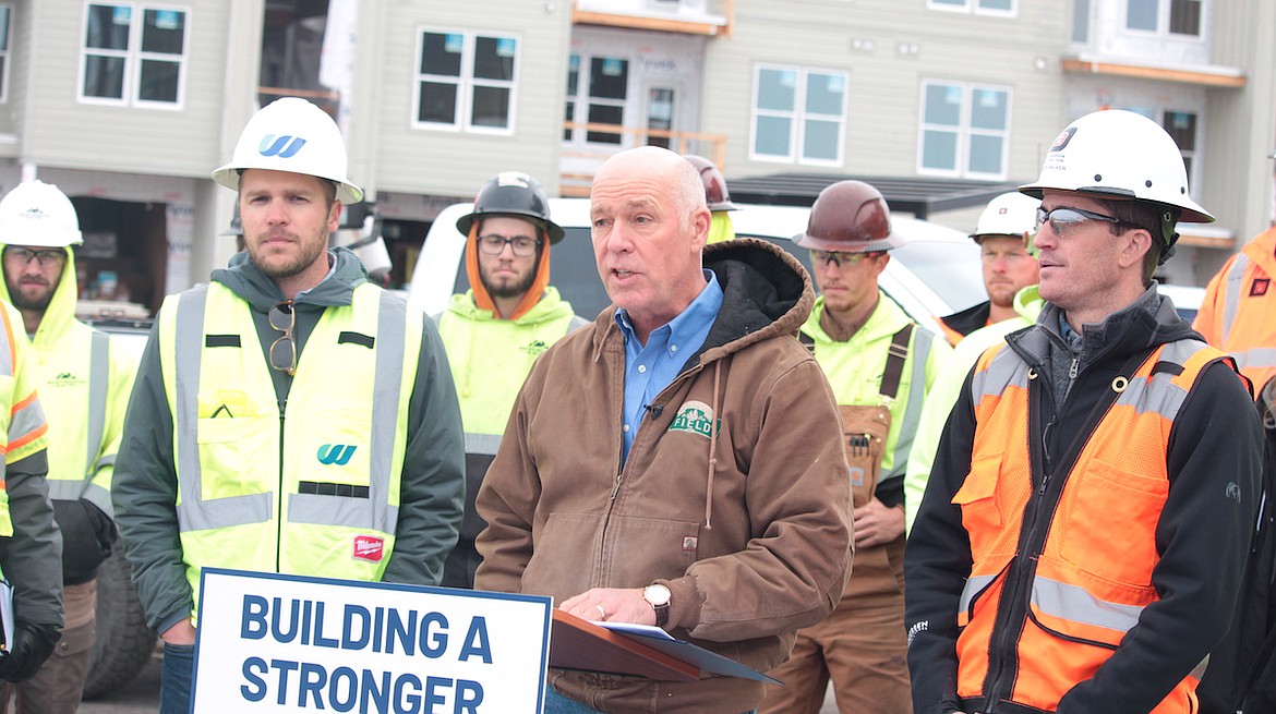 Gov. Greg Gianforte speaks alongside construction leaders and trades apprentices at a Bozeman construction site on Thursday, Oct. 27, 2022. (Eric Dietrich/MTFP)