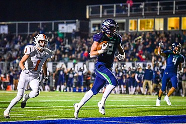 Glacier running back Jackson Hensley (2) scores a touchdown on a 16-yard run in the third quarter against Billings Senior at Legends Stadium on Friday, Oct. 28. (Casey Kreider/Daily Inter Lake)