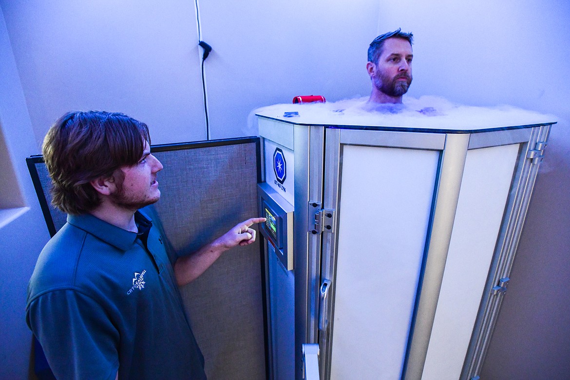 Owner Ethan Taft, left, treats Gary Downing inside the Whole Body Cryo Chamber at Cryo Kalispell on Friday, Oct. 28. (Casey Kreider/Daily Inter Lake)