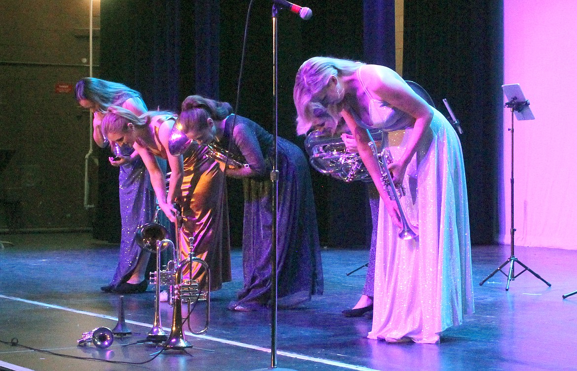 The members of Seraph Brass take their final bow to a standing ovation Thursday. From left: Raquel Samayoa, Victoria Garcia, Rachel Velvikis, Cristina Cutts Dougherty (partly obscured) and Mary Elizabeth Bowden.