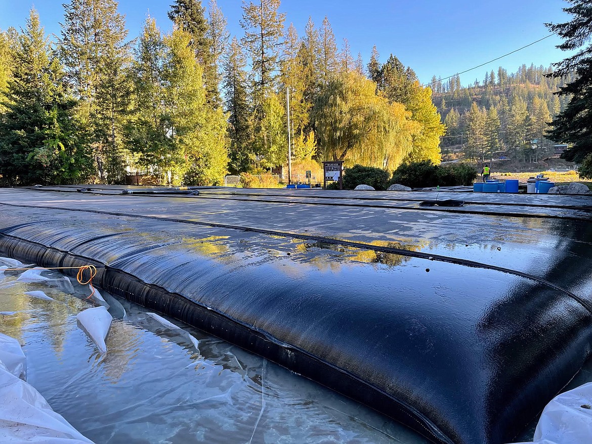 Filter bags containing a special polymer are being used to remove sediment from the channel between Upper and Lower Twin Lakes. The  Channel Sediment Removal Project is underway and expected to be completed by spring.