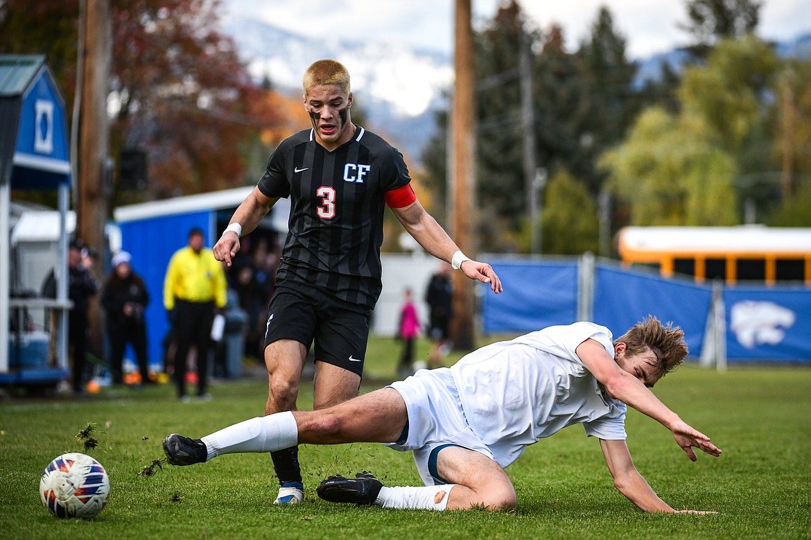 Livingston's Baylor Arterburn (12) knocks the ball away from Columbia Falls' Josiah Kilman (3) in the first half of the State A Championship game against Livingston at Flip Darling Memorial Field in Columbia Falls on Saturday, Oct. 29. (Casey Kreider/Daily Inter Lake)